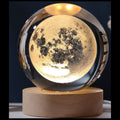 Moon-shaped lamp with wooden base on a dark background